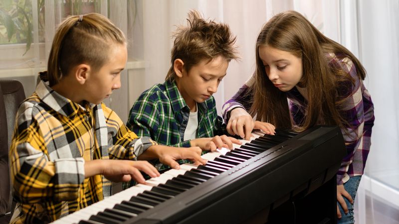 Focused Trio at Piano