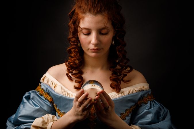 Baroque woman with glass ball
