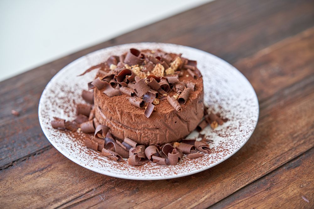 Tasty chocolate cake decorated with shavings