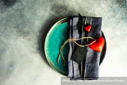 St. Valentine day card concept with teal plate with cutlery & hearts 5XrrXV