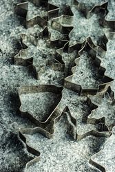 Top view of cookie cutters scattered on table