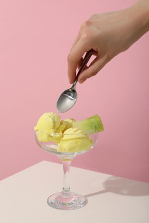 Melon flavored ice cream on a pink background