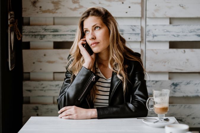 Woman using smartphone at table