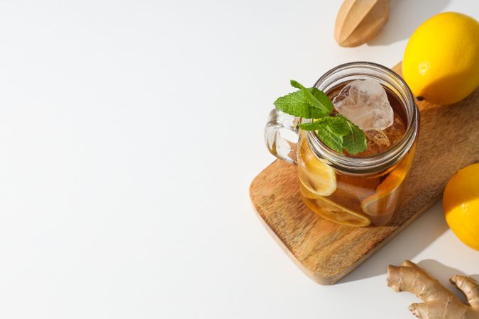 A glass of cold tea with fresh orange slices