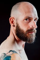 Pensive adult bearded man