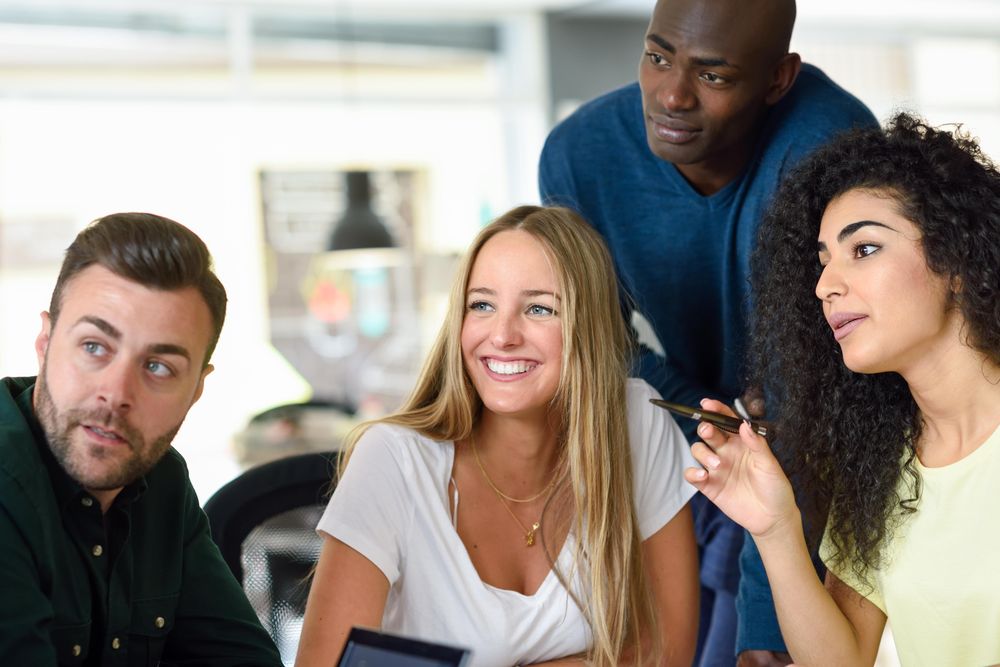 Four people looking around at the same time
