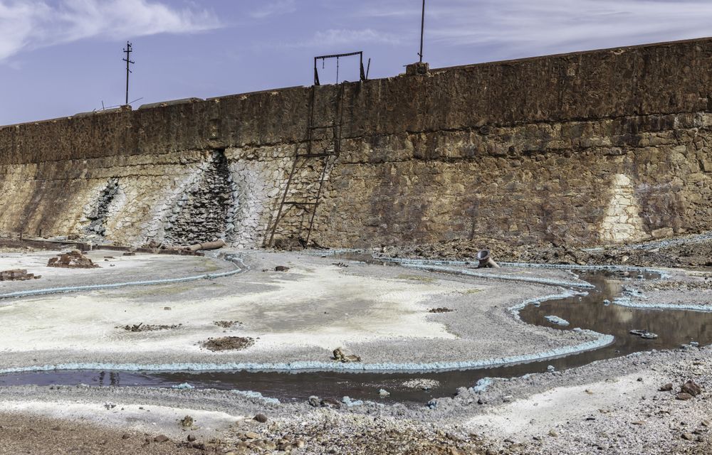 Water spills on rocky territory of mines