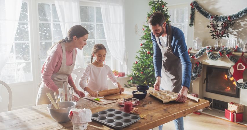 Parents and Child Baking Together During Christmas.