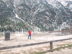 Man standing and taking photo of rocky landscape
