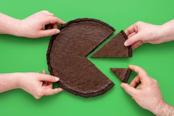 Pie chart concept, people sharing chocolate cake, above view on a green background