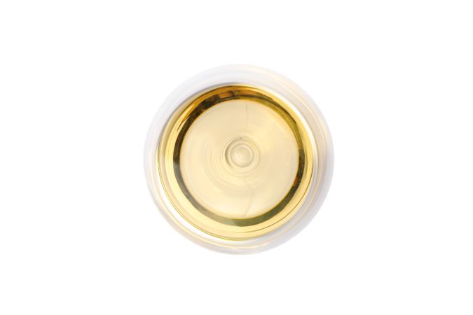Glass with wine isolated on plain background, top view