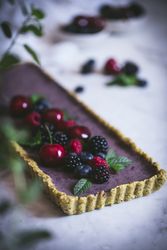 Fresh blueberry pistachio cake with whole berries on top
