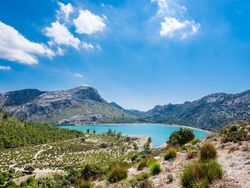 Lake surrounded by mountain ridge