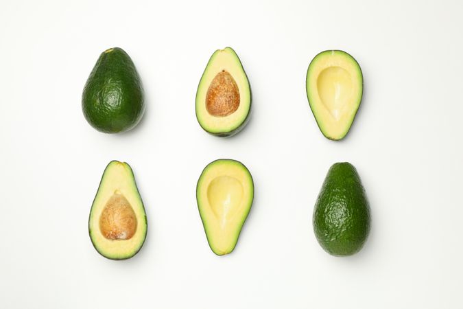 Flat lay with avocado on plain background, top view