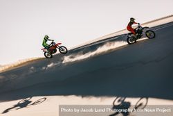 Motocross racers racing in desert 5RAwR0