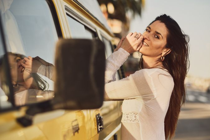 Young woman on a yellow van