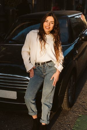 Cheerful young woman in street