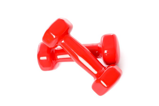 Red dumbbells for fitness isolated on plain background