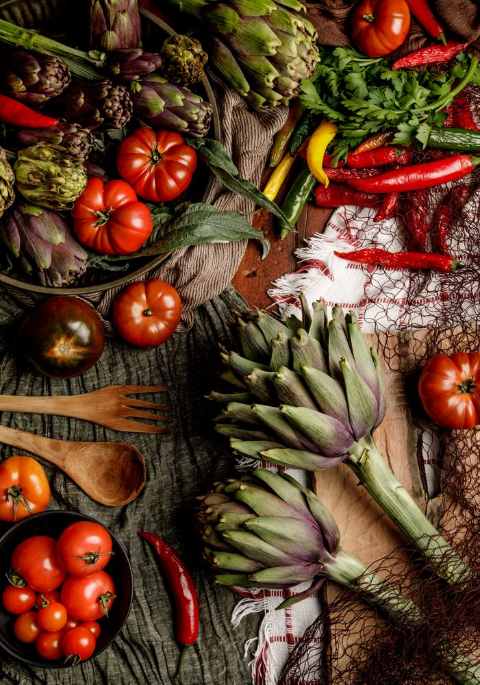 Assorted vegetables and napkins on table