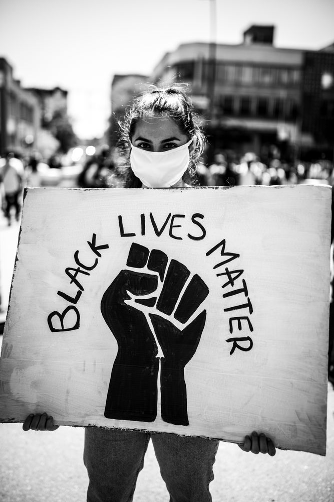 MONTREAL, QUEBEC, CANADA – June 7 2020- Woman holding a sign during a protest