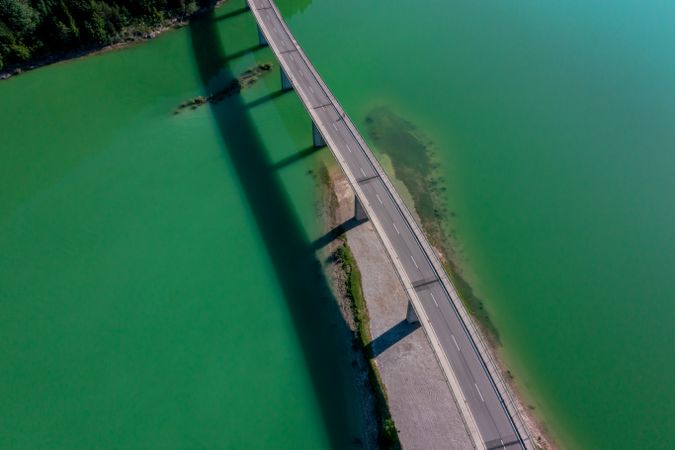 Aerial view of the Sylvenstein Lake Bridge in the bright light of summer