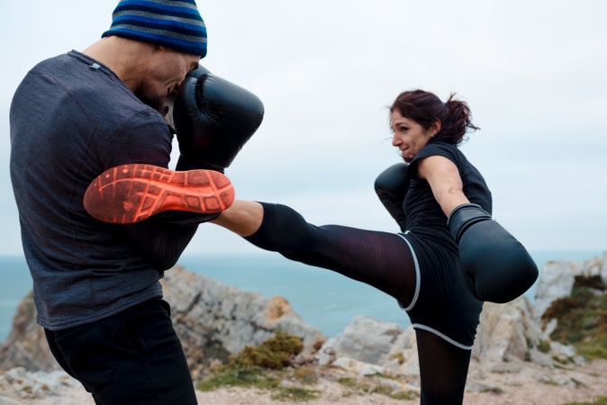 Boxers exercising on cliff