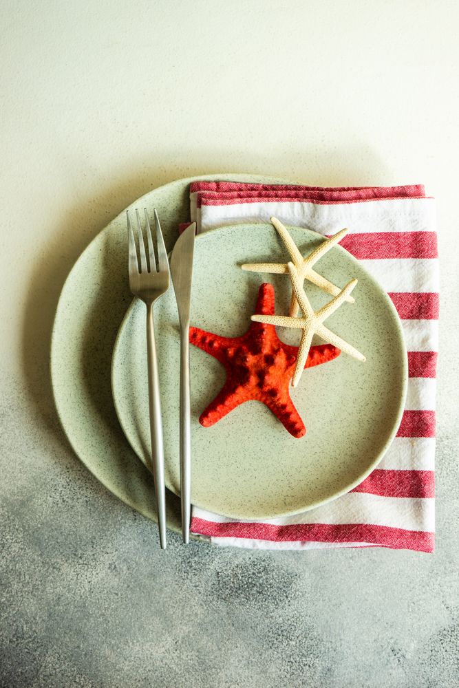 Marine table setting with sea stars on plate