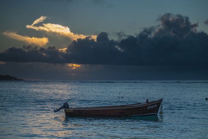 Simple boat in Indian Ocean at dusk