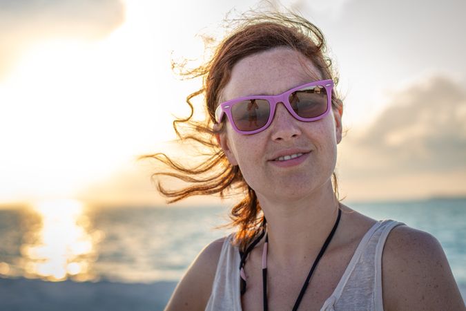 Woman in sunglasses at the beach