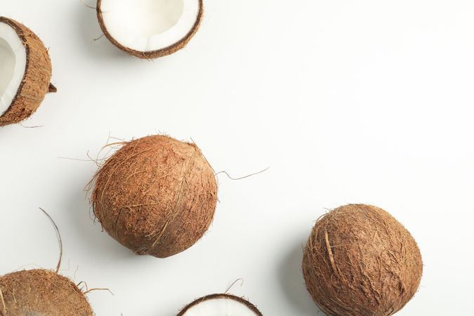 Flat lay with coconut on plain background, top view