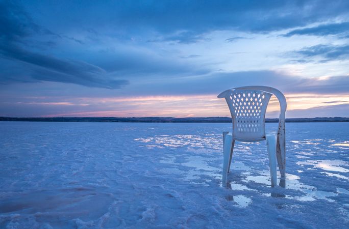 Chair on salt mine during sunset