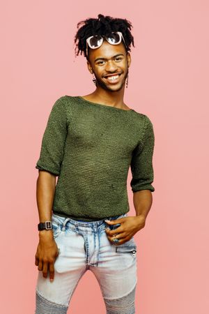 Studio portrait of a young man smiling looking at camera