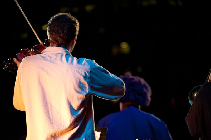 Los Angeles, CA, USA - July 12, 2012: Backshot of Miguel Atwood-Fergusonn playing violin