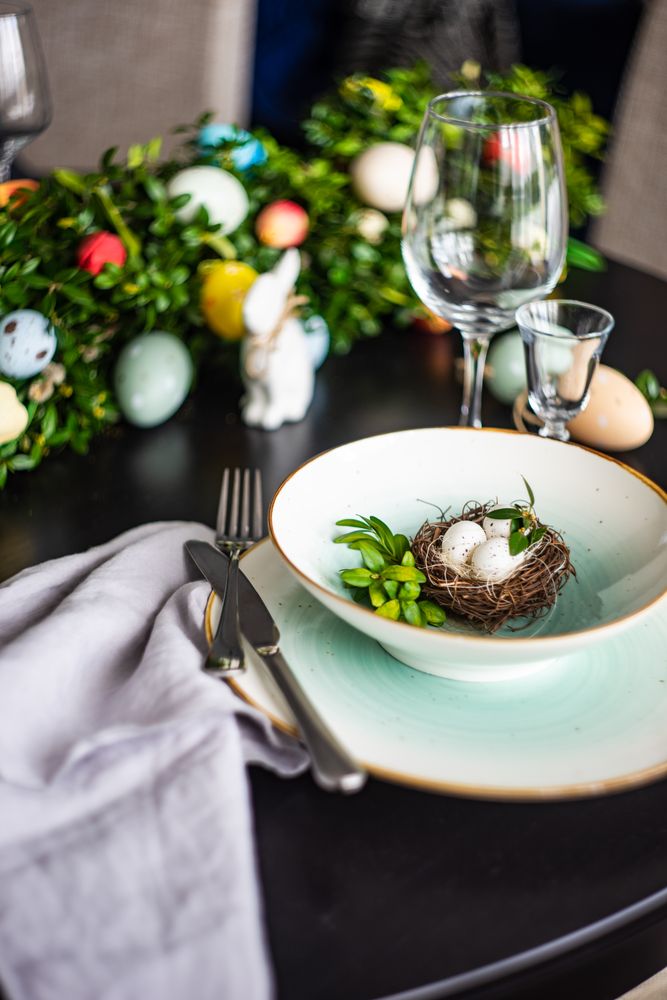 Delicate decorative nest in bowl for spring table setting