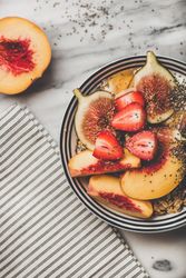 Flat-lay of yogurt bowl with fruit