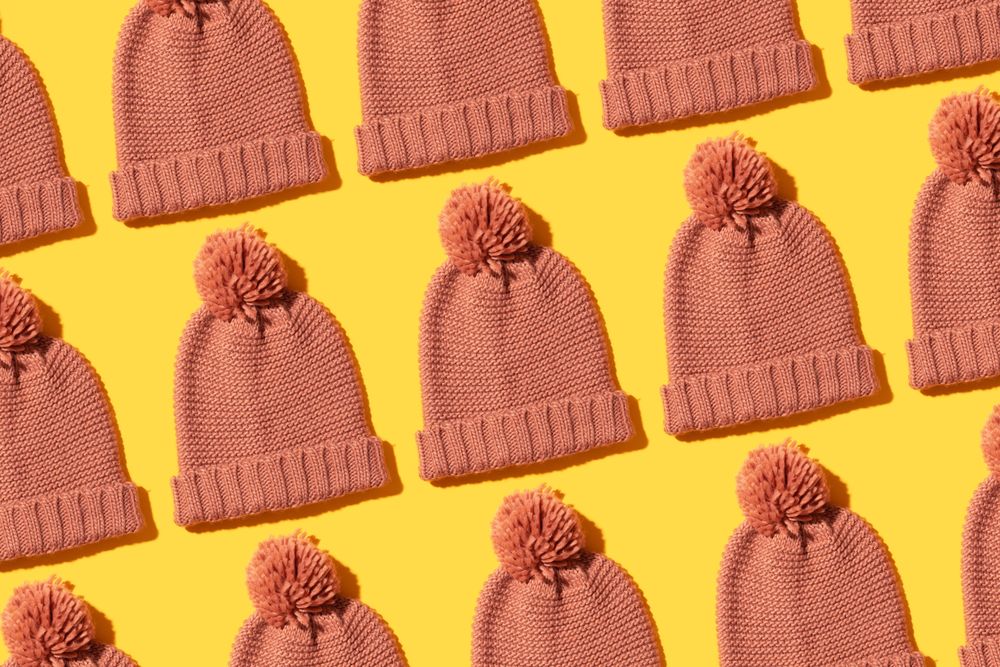 Beanies on orange background