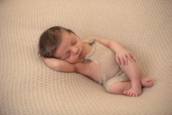 portrait of baby asleep in bed