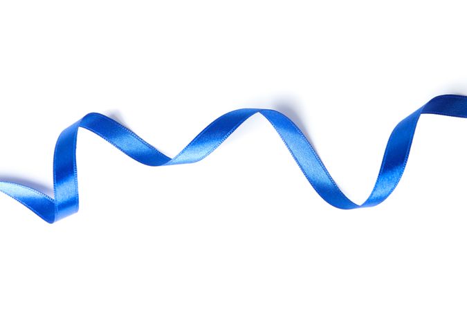 Blue ribbon isolated on plain background. Gift concept