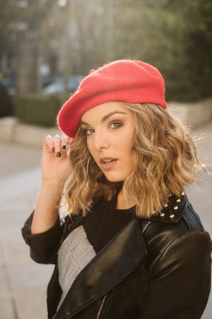 Stylish female in beret looking at camera