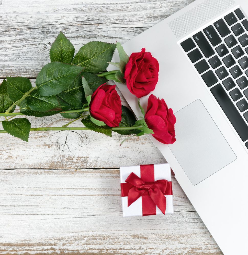Close up view of aged desktop with Valentines day romance concept at workspace