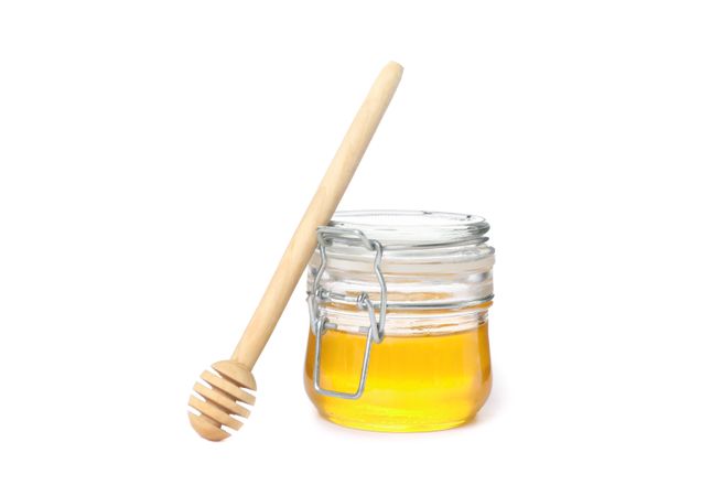 Dipper and glass jar with honey isolated on plain background