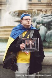 London, England, United Kingdom - March 5 2022: Man in Ukrainian flag at anti-war protest 5kngo0