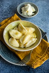 Traditional yellow bowl of Ukrainian dish vareniki