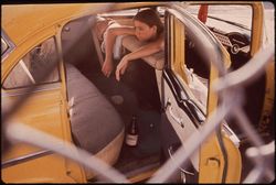 Young woman in a vehicle in Second Ward Neighborhood, El Paso 1972 43JjR5
