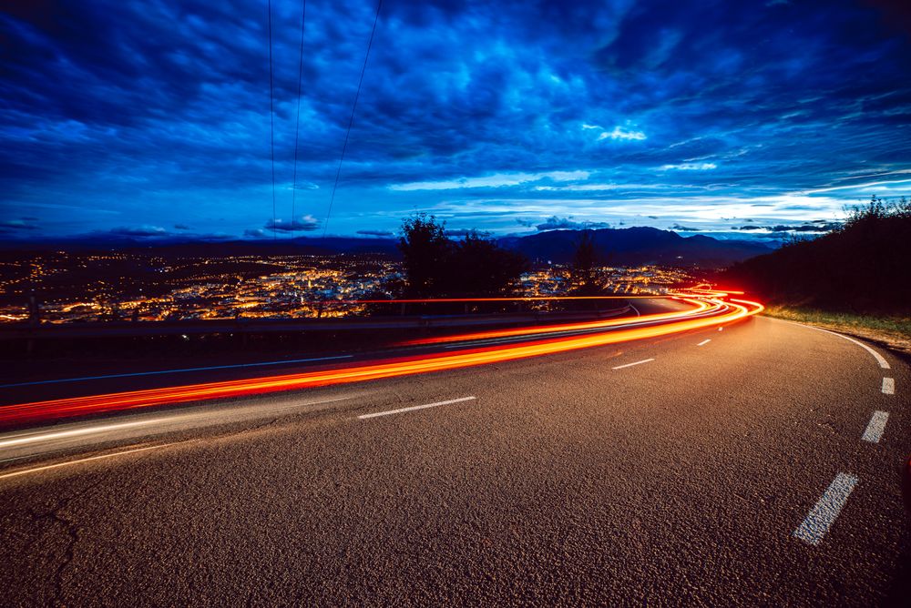 View of abstract shines on road at night