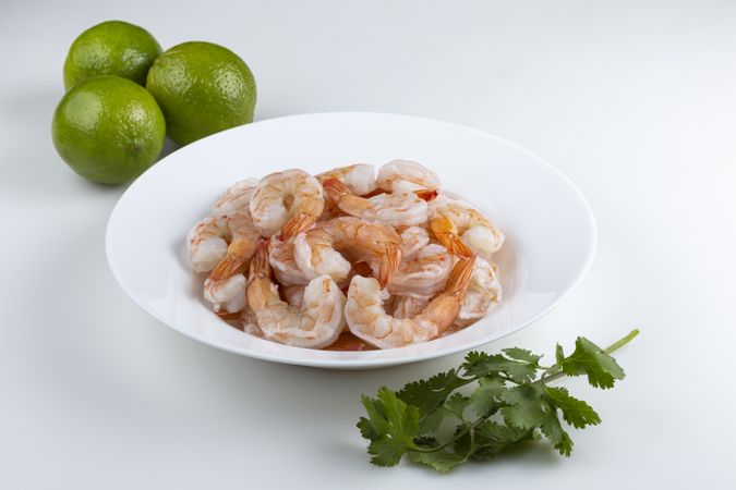 Fresh raw prawns on blank background.