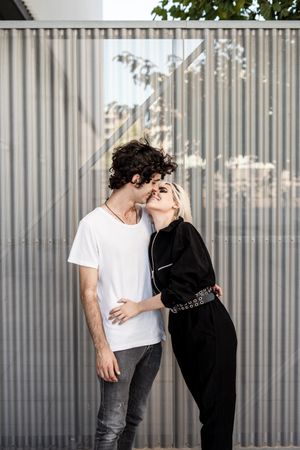 Couple near stripped modern building