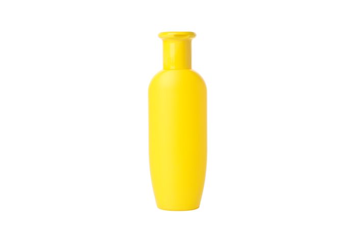 Blank bottle for shampoo isolated on light background