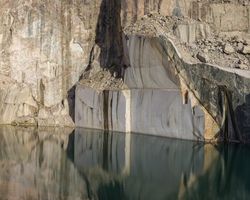 Calm water near stone quarry