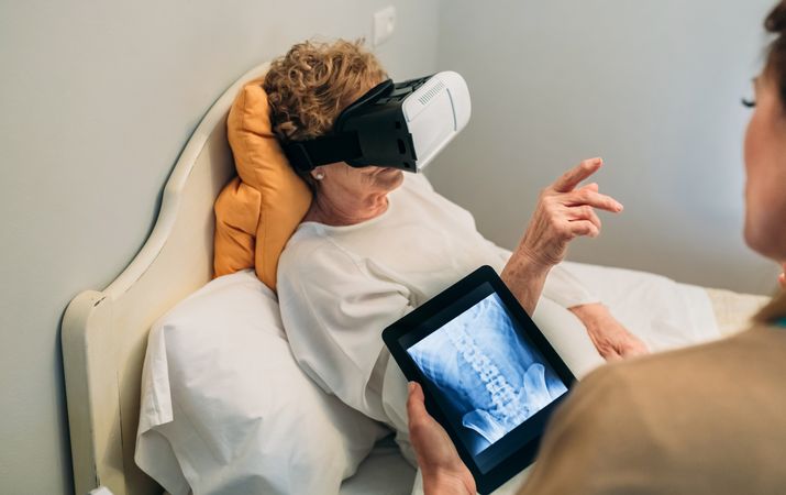 Older patient using virtual reality glasses